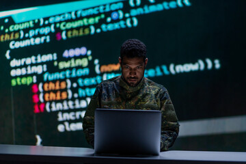 Hacker in military unifrorm on dark web, cyberwar concept.