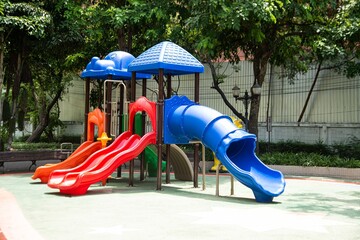 Colorful playground made of plastic empty outdoor playground set playground equipment.  Play area. Garden equipment. Children's slide. Playground in the park..