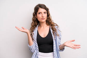 young adult pretty woman looking puzzled, confused and stressed, wondering between different options, feeling uncertain