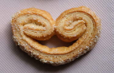 Tasty puff pastry cookie with sugar sprinkle