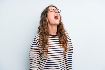 young adult pretty woman screaming furiously, shouting aggressively, looking stressed and angry