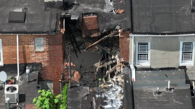 Front of urban city home in disrepair, abandoned in crime infested neighborhood. Poverty and crime in USA theme.