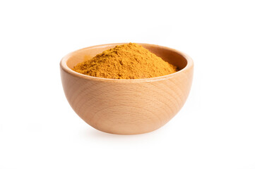 Turmeric powder in wooden bowl isolated on white background.