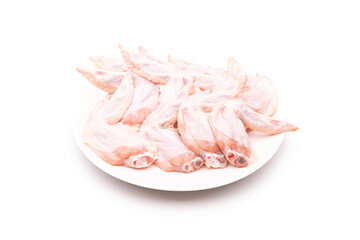Raw chicken wing in white dish isolated on white