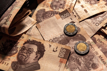 Fototapeta na wymiar Money piled on a table, mexican peso currency
