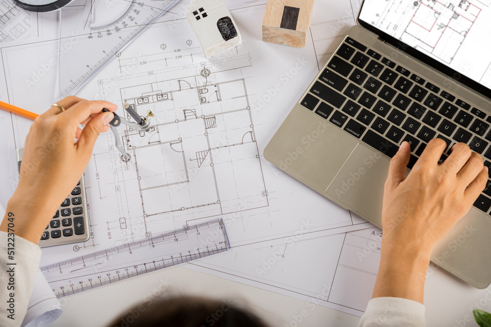 Poster architectural project workplace. architect typing laptop keyboard to review design of house building