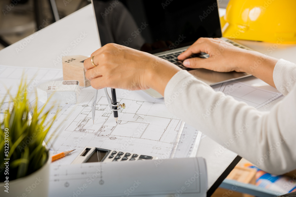 Poster architectural project workplace. architect typing laptop keyboard to review design of house building