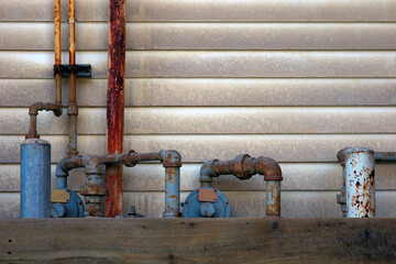 natural gas inlet outside pipeline biogas flow valve rusty metal pipes