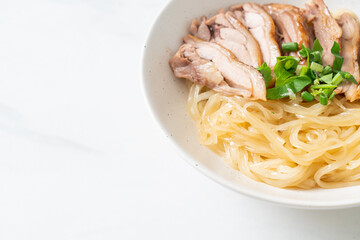 dried noodles with stewed duck in white bowl