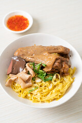 Egg noodles served dry with braised duck