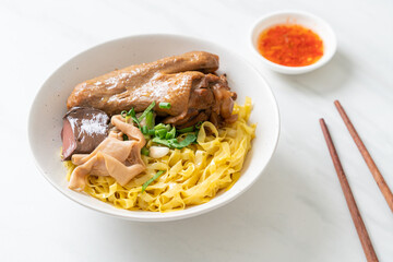 Egg noodles served dry with braised duck