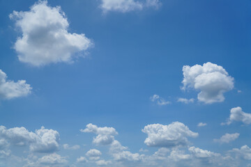 Naklejka na ściany i meble White clouds are floating in the blue sky