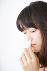 Young woman getting a bloody nose