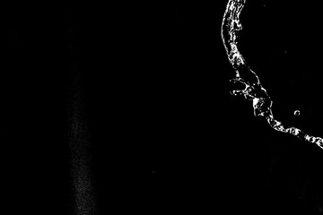 Obraz premium water splashes isolated on black background. white jets with drops