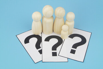 Family people figures on question marks on blue background. What is family, family faq, problems and solutions concept.