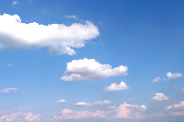 Natural clouds group with light wind on vast bright blue sky scenic background