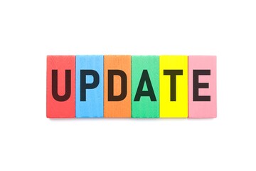 Colorful wooden blocks with word UPDATE on white background