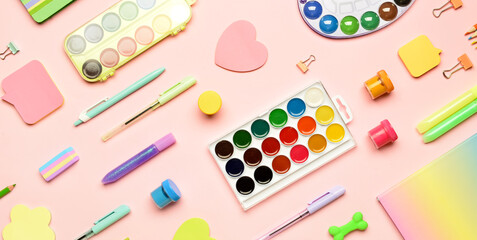 Different school supplies on color background, top view