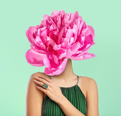 Woman with peony flower instead of her head on green background © Pixel-Shot