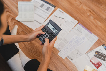 Top view financial owe asian young man sitting suffer, stressed and confused by calculate expense...