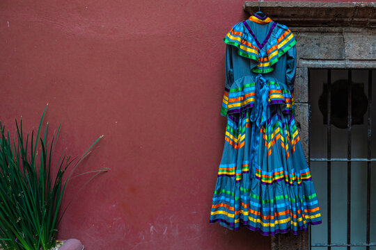 Women's Blue Dress For Traditional Mexican Folk Dance Hanging On The Wall