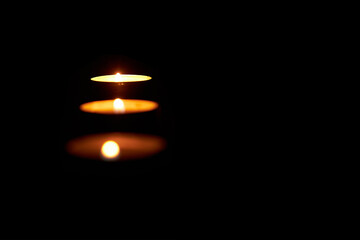Candles in the dark with soft selective focus and bokeh.