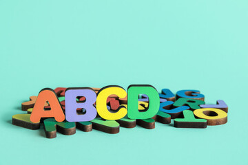 Colorful letters on blue background. Alphabet concept