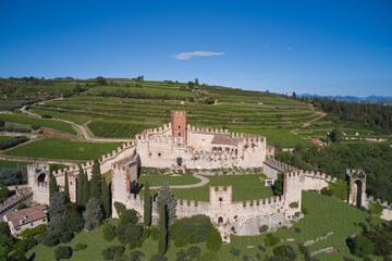 Soave castle aerial view Verona province, Italy. View of Soave castle surrounded by vineyard plantations. Ancient castle on a hill in Italy.