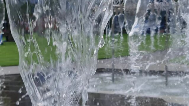 Melbourne, Victoria, Australia, 04-18-2022 Parliament Gardens and Coles Fountain. The fountain has curtains of water which offers respite from the heat on a hot day