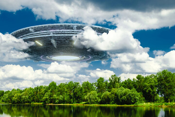 UFO, an alien saucer hovering over the field, hovering motionless in the air. Unidentified flying...