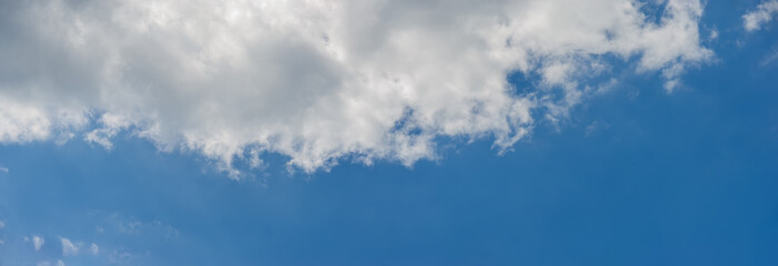Dark part of the cloud on the background of the sky.