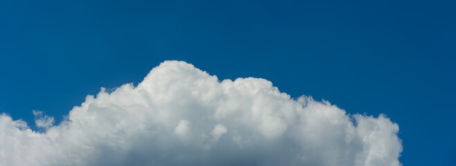 Cloud against the blue sky on a sunny day.