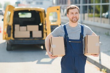 My deliveries are all running on schedule. Portrait of a delivery man unloading boxes from his van.
