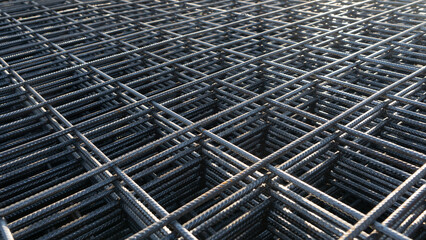 The rebar is bonded with steel wire for use as a construction infrastructure. Which part of the rebar has rusted due to chemical reactions. - obrazy, fototapety, plakaty