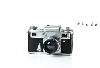 Old Soviet rangefinder analog camera top view on a white background