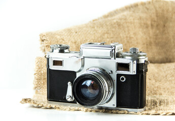 Old Soviet rangefinder analog camera top view on a white background