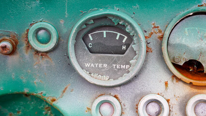 
Broken water temperature indicator. Water temperature breaking and rusting. Water pressure temperature display. Old pump.