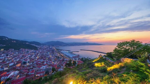 Time-lapse of city Giresun, Turkey from day to night. Sunsets over the sea. Beautiful 4K shot