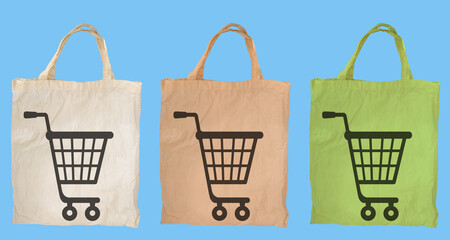 green, beige canvas bags with grocery cart sign, eco-friendly linen shopping bag on a isolated...