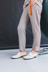 Beige women's leather shoes close-up on female legs. New collection of women's summer leather shoes.