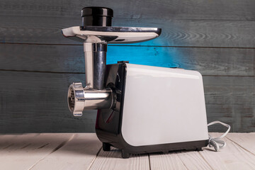 soft focus. electric meat grinder its components lie side by side. close-up.