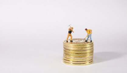 Worker figure standing on bitcoin. Bitcoin mining concept.