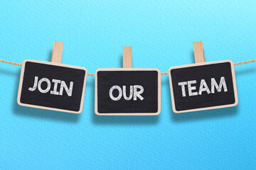 Join our team written chalkboard hanging on rope