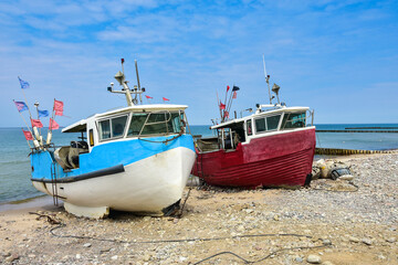 colorful fishing boats, a beach and the Baltic Sea in Poland