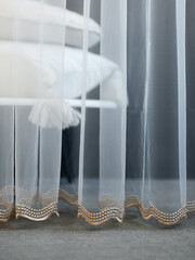 Curtains and tulle in white and blue in the interior