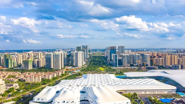 Aerial Hyperlapse of Haikou City Western Coast, with Hainan International Convention And Exhibition Center, Office Buildings, Residential Apartmentsin the View.