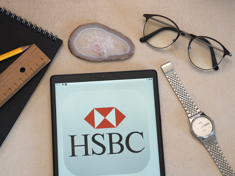 In this photo illustration HSBC Holdings plc logo seen displayed on a tablet