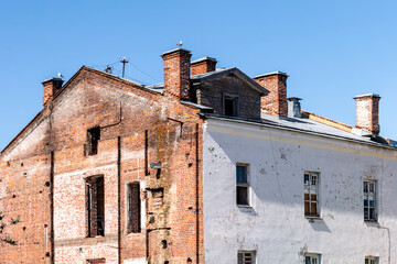 Fototapeta na wymiar abandoned and destroyed old brick building