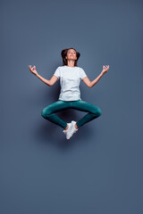 Full length photo of pretty calm person meditate jumping retreat om isolated on grey color background