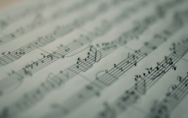 Music notes macro background, handwritten notes, selective focus